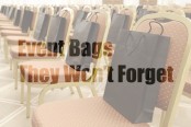 Black Event Bags on Chairs Lined Up Next to Each Other